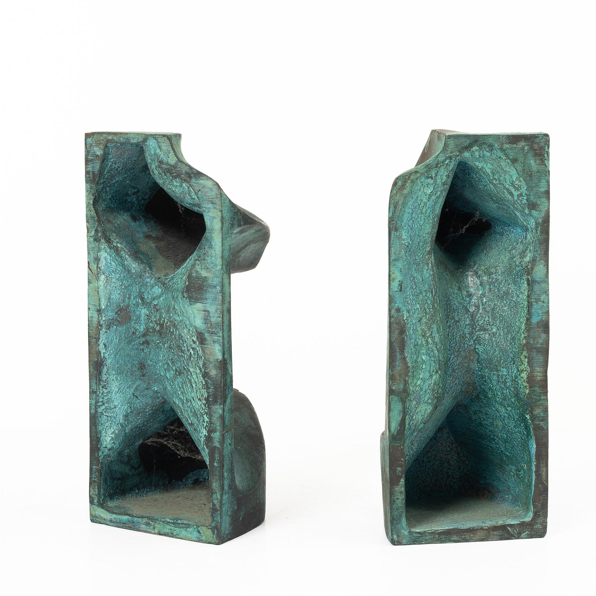 Björn Selder, a pair of green-patinated bronze sculptures/bookends, signed and numbered 4/100.