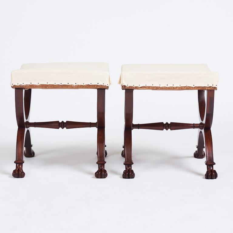 A pair of Directoire mahogany stools, circa 1800.