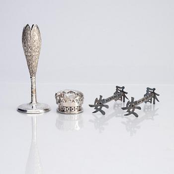 A silver bud vase, two stands for the butter knifve and a salt, China, early 20th Century.