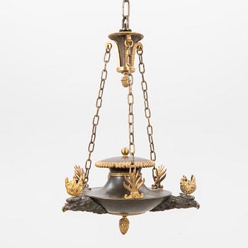 An Empire bronze chandelier.