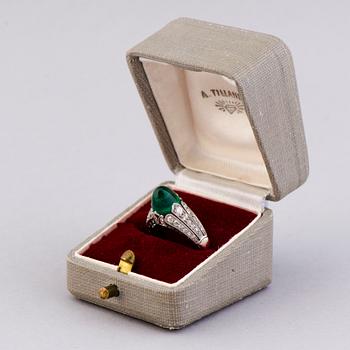 A RING, cabochon cut emerald, old cut diamonds. Alexander Tillander, St Petersburg 1855-1918.