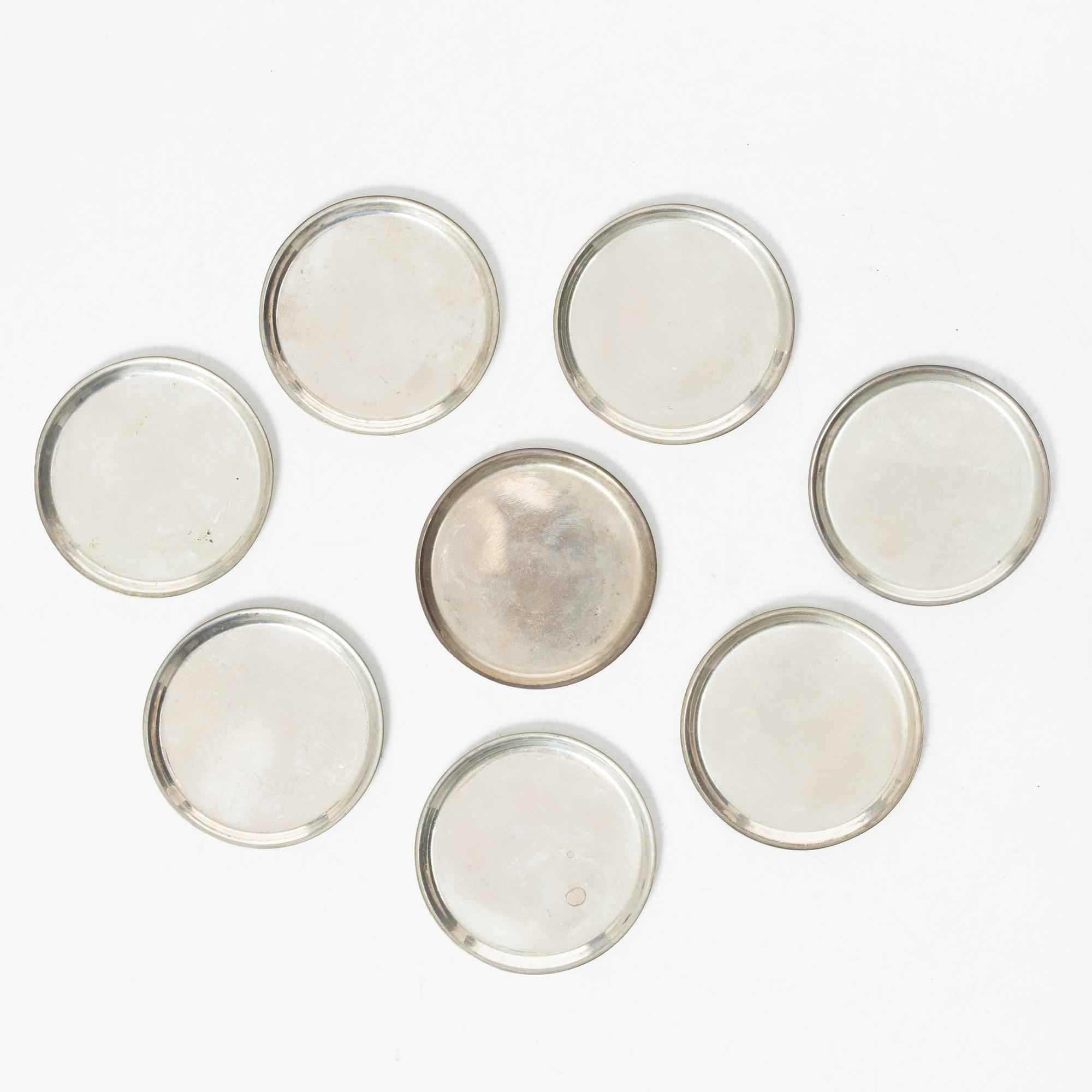 Eight coasters, silver 900, 20th century.