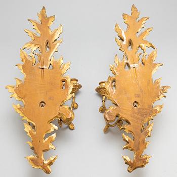 A pair of 20th century Rococo style wall lights.