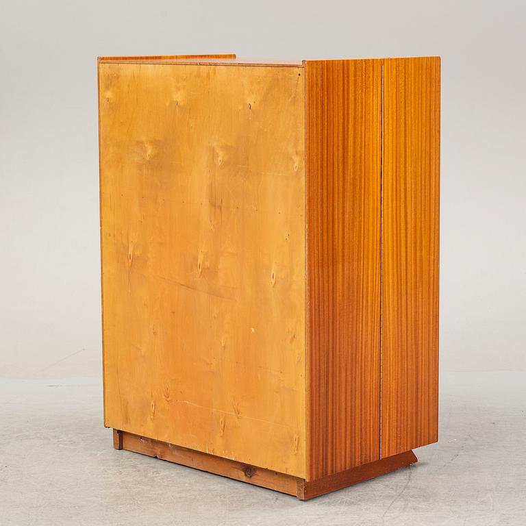 A mahogany veneered convertible cabinet, mid 20th Century.