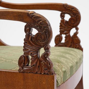 A pair of Baltic / Russian mahogany Empire armchairs, first part 19th century.