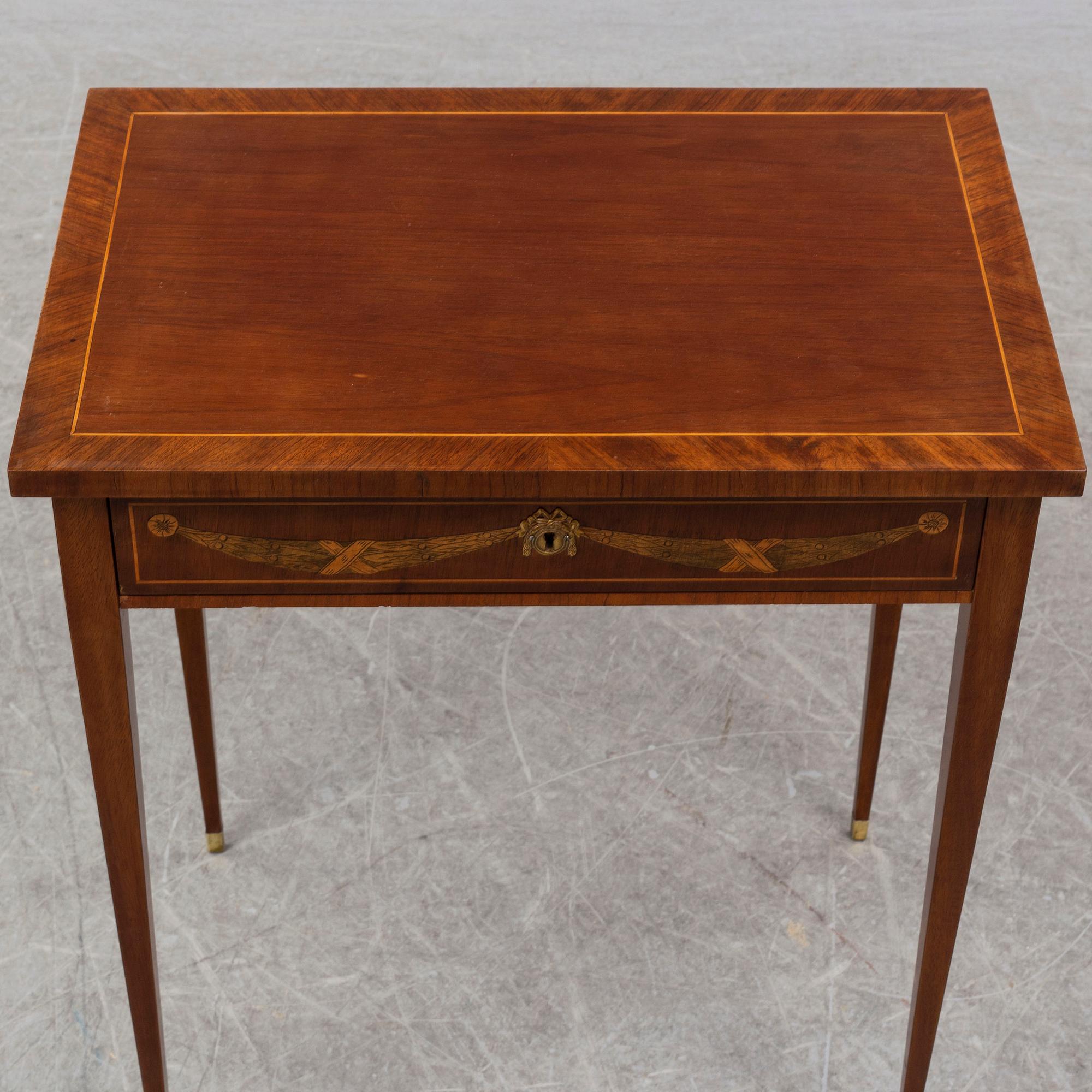 A gustavian style sewing table, early 20th century.