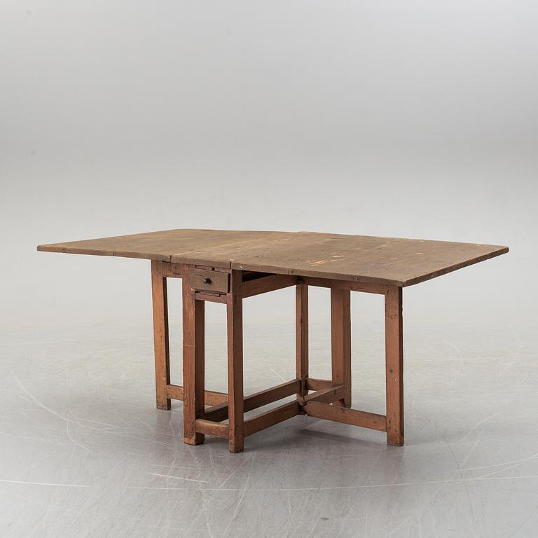 A 19th century painted gate leg table.