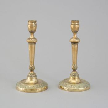 A pair of late 18th century bronze candlesticks.