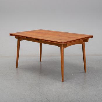 Hans J Wegner, a teak dining table, Andreas Tuck, Denmark.