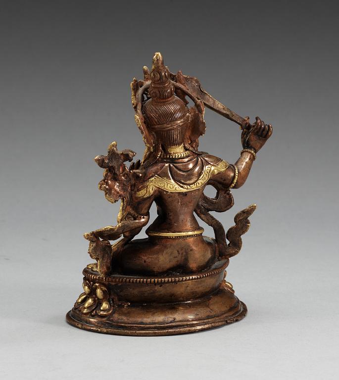 A Sino-tibetan gilt copper figure of a Bodhisattva, Qing dynasty, 19th Century.