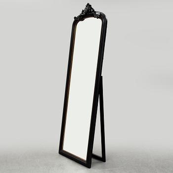 A contemporary floor mirror.