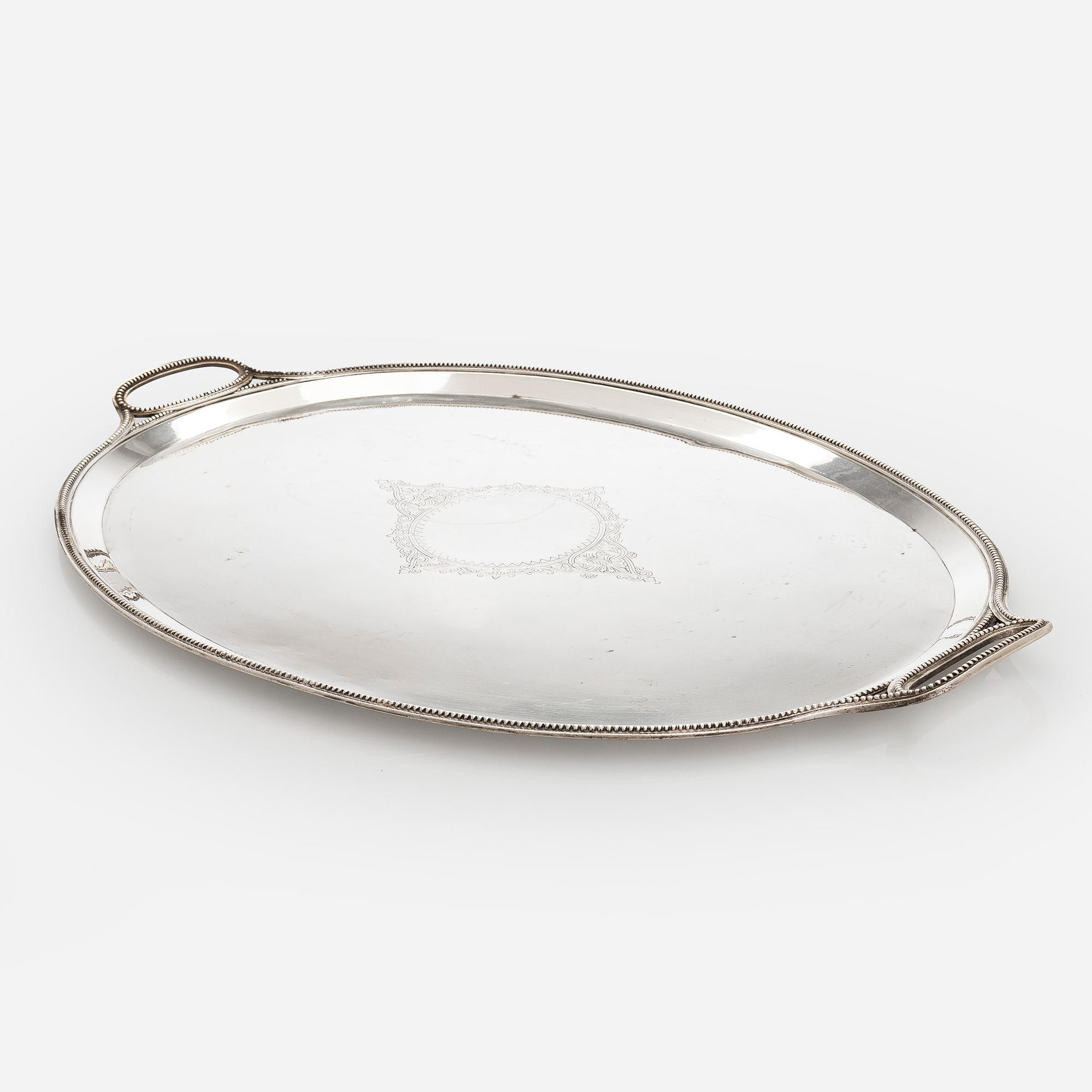 A Khlebnikov silver tray, with the Imperial court supplier's mark, Moscow 1888.