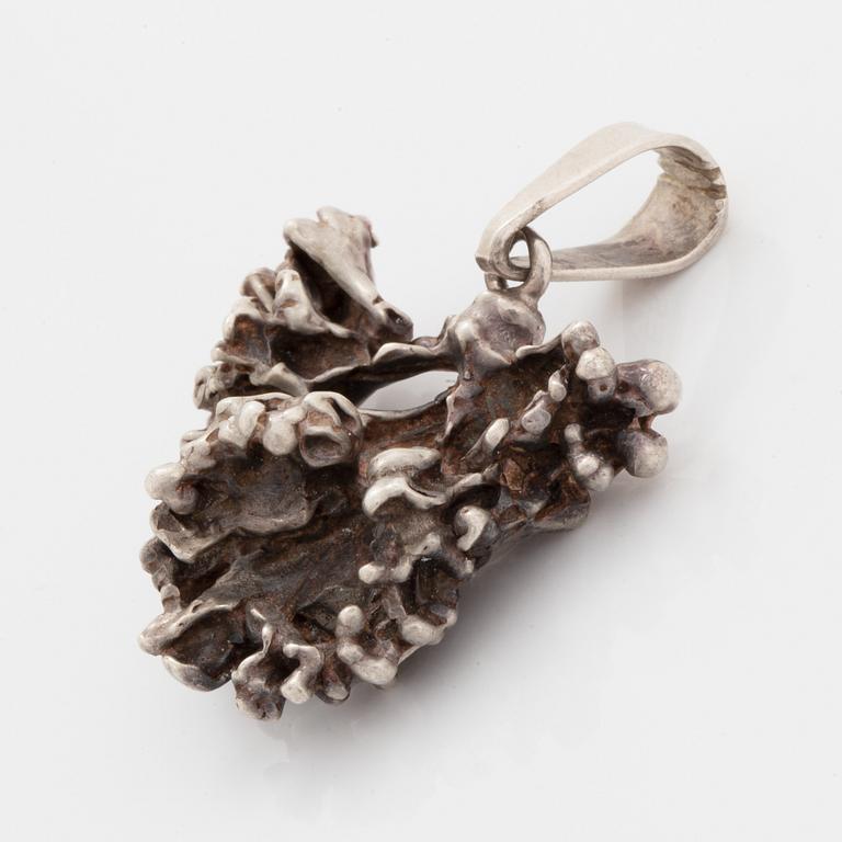 Five pendants and one brooch, silver.
