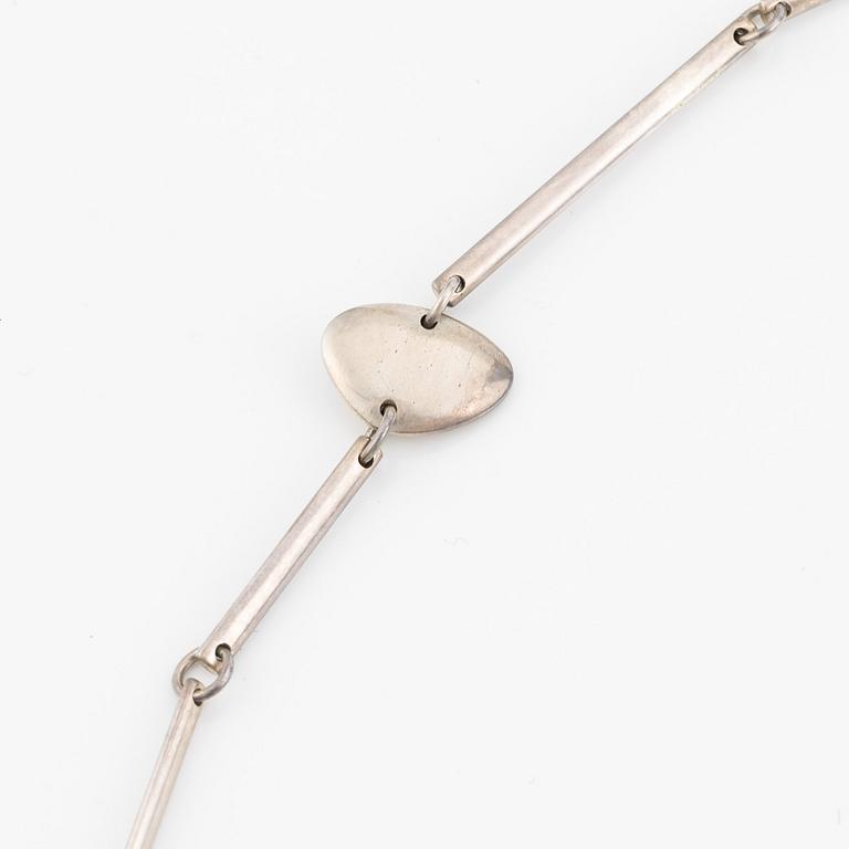 Georg Jensen, a necklace and a pair of earrings, sterling silver.
