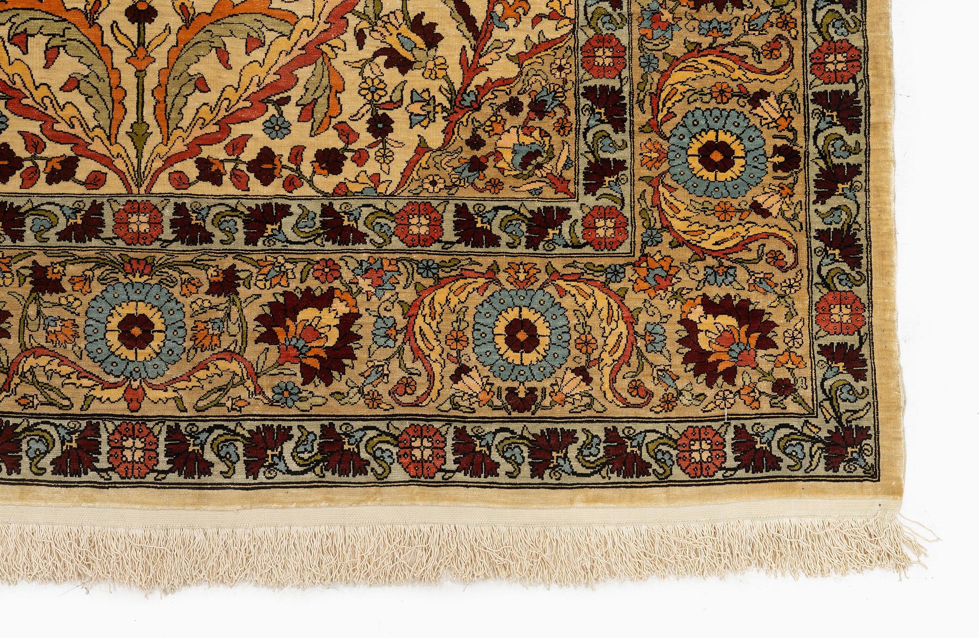 A semi-antique silk Hereke rug, c. 155 x 103 cm.