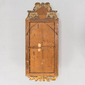 A Gustavian mirror signed Johan Åkerblad (master in Stockholm 1758 - 1799), dated 1785.