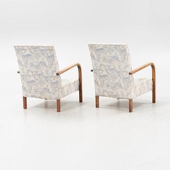 A pair of 1930's armchairs.