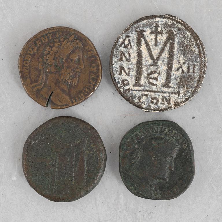 Four Roman coins.