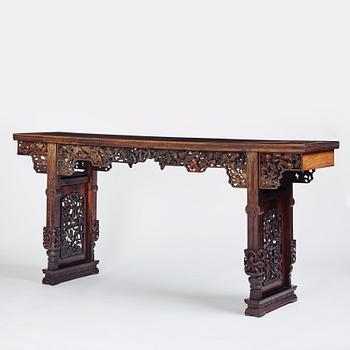 A massive zitan recessed-leg long table 'Jiaotousun Qiotouan', Qing dynasty, 19th century.