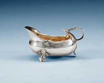 699. A Swedish 18th century parcel-gilt cream-jug, unidentified makers mark.
