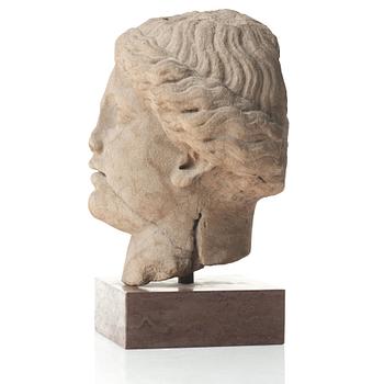 A marble head of a woman, probably Roman 100-200 AD.