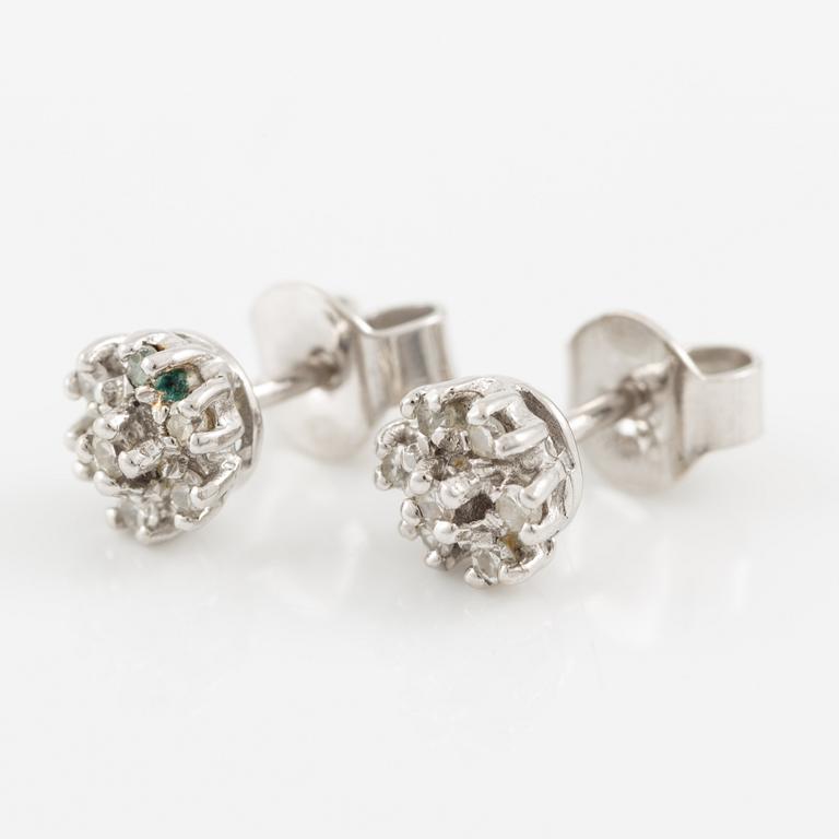 A ring and a pair of earrings in 18K white gold set with round brilliant-cut and octagonal-cut diamonds.