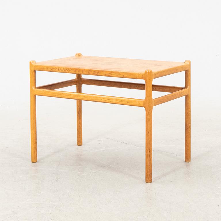 An oak side table by Johannes Andersen Denmark middle of the 20th century.