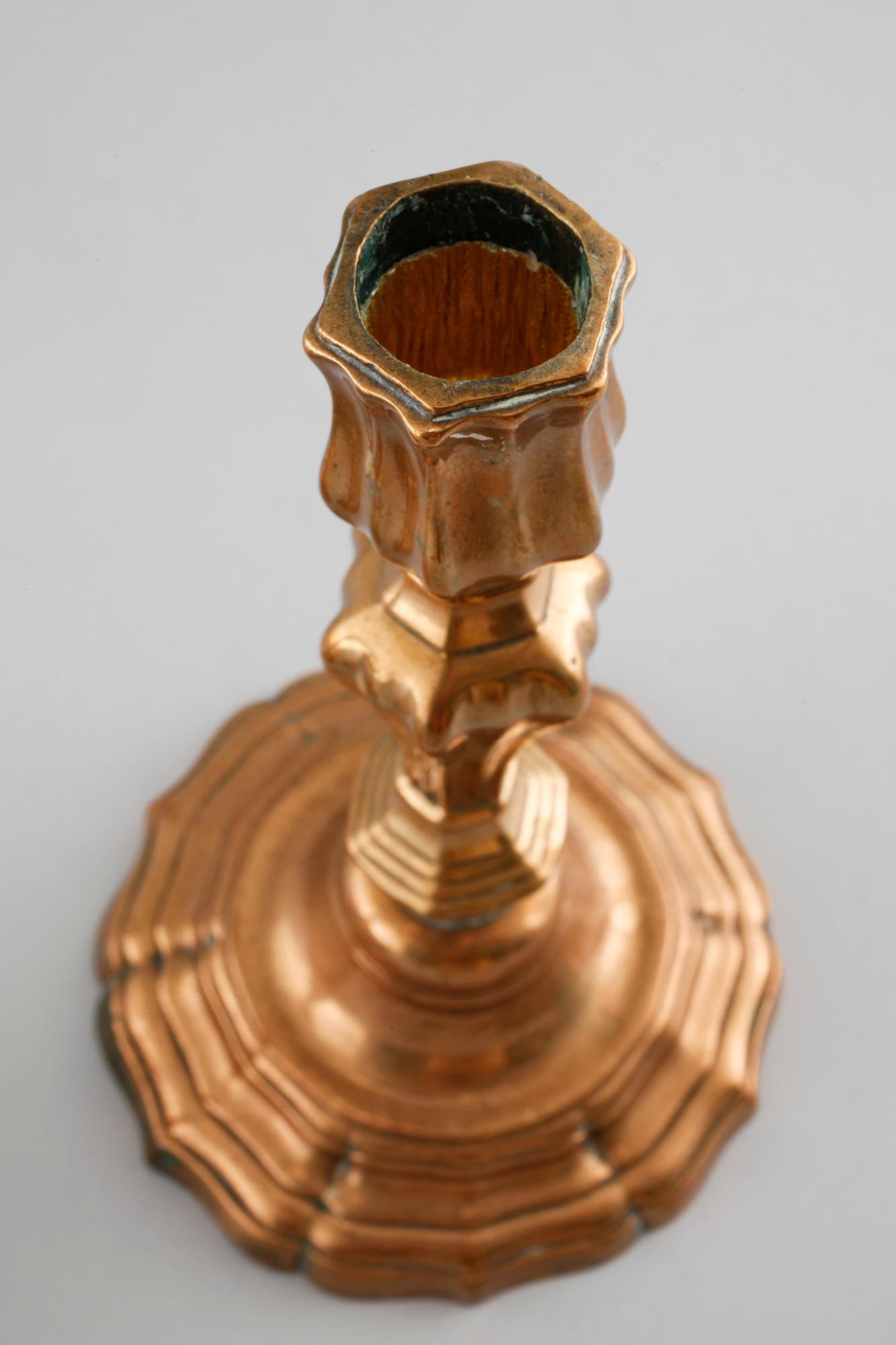 A pair of late barouqe bronze candlesticks, 18th century.