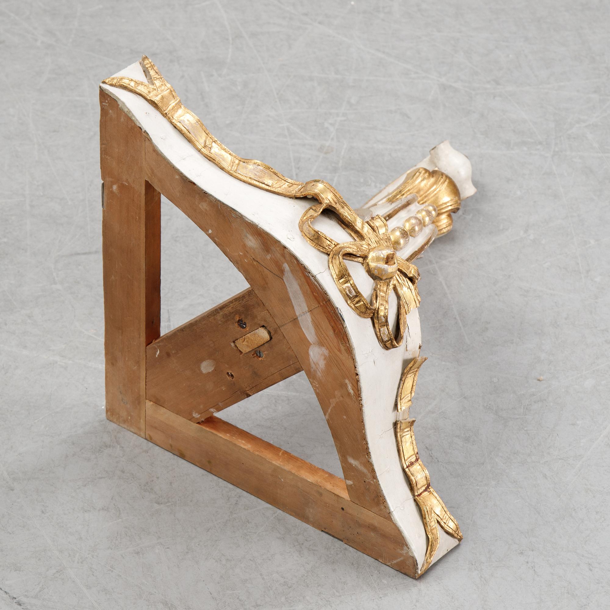 A samll console table for a corner with a wooden top.