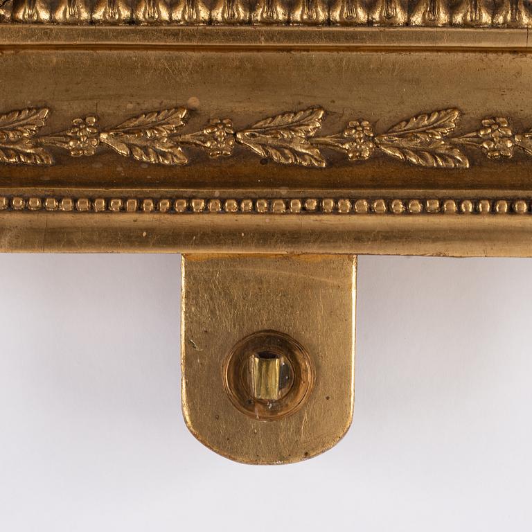A pair of Swedish Empire mirror wall sconces, first half of the 19th century.