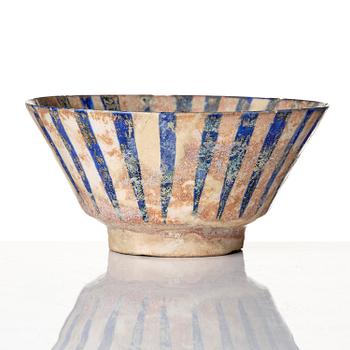 A cobalt glazed radila design pottery bowl, Persia (Iran), 12th/13th century.