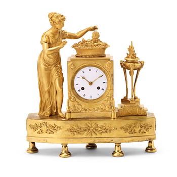 1287. A Directoire circa 1800 gilt bronze mantel clock.