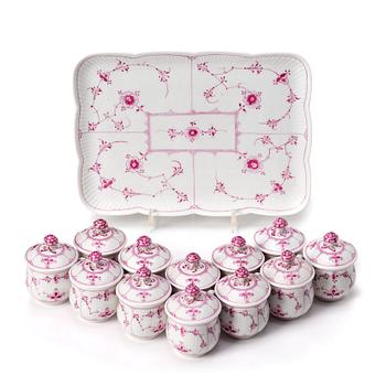 A set of 12 Royal Copenhagen Ruby Red Musselmaalet custard cups with a tray, Denmark, circa 1900-1923.