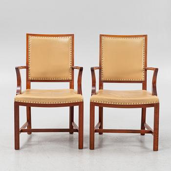A par of stained beech wood armchairs, end of the 20th Century.