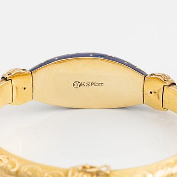Armring, guld, blå emalj och rosenstenar.