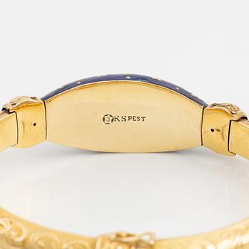 A bangle, gold, blue enamel, and rose cut diamonds.