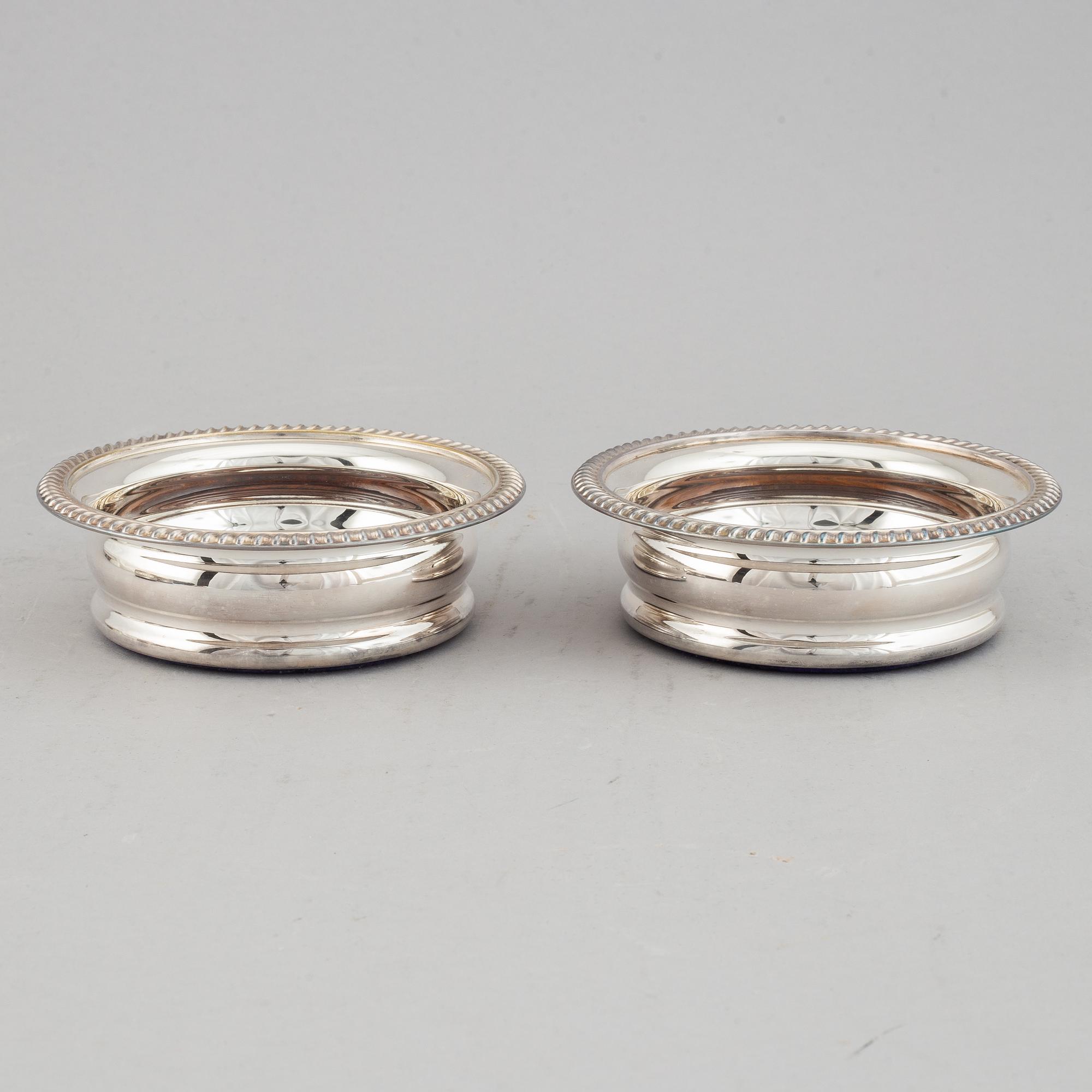 Coasters, two pairs, silver plate, England.