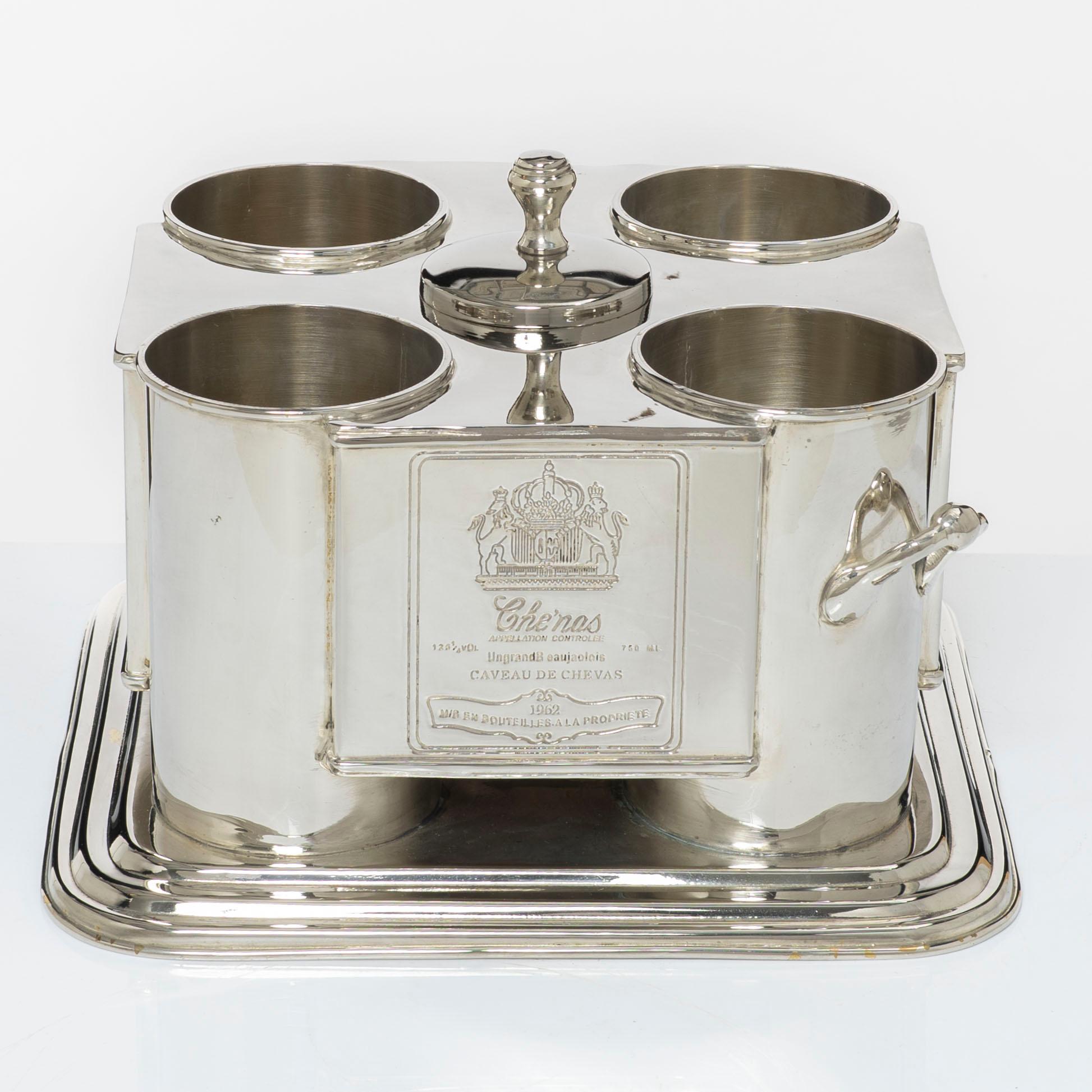 A silver plated four-bottle wine cooler.