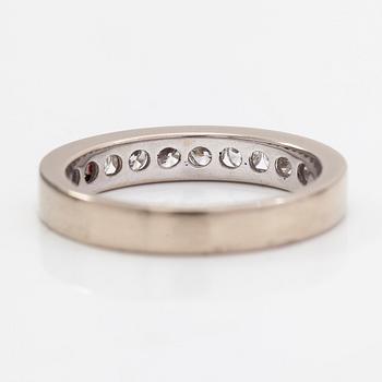 An 18K gold eternity ring with brilliant cut diamonds 1.0 ct in total according to engraving.
