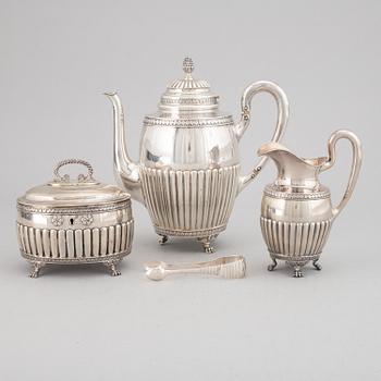 A swedish silver coffee pot, creamer sugar box and sugar tongs, mark of Samuel Pettersson, Linköping 1900.