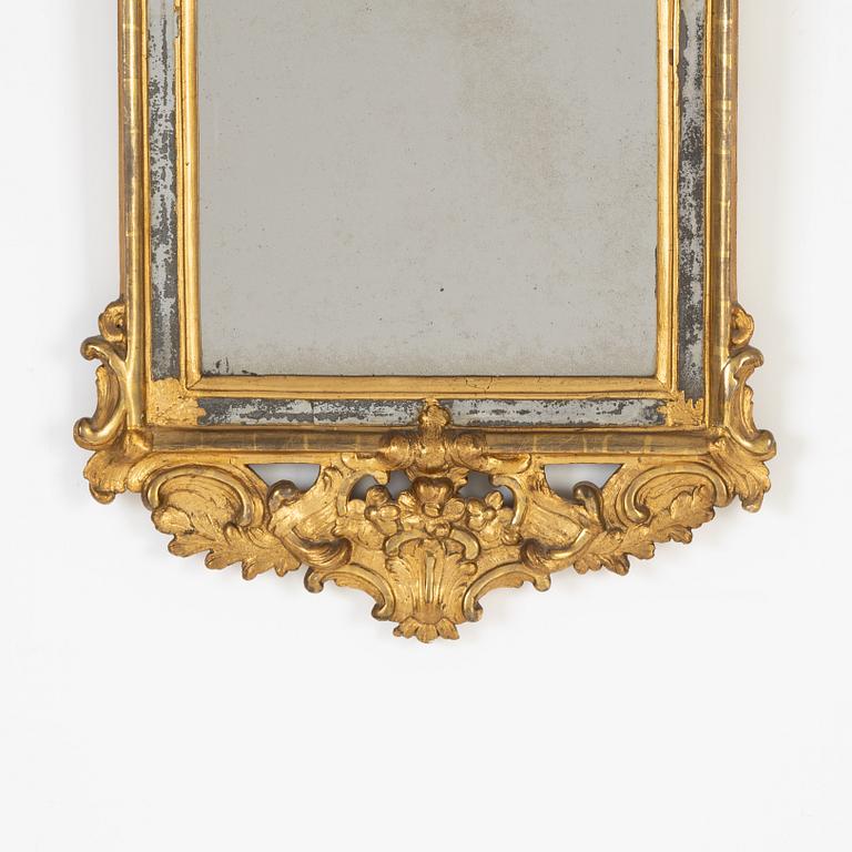 A rococo mirror, second half of 18th Century,