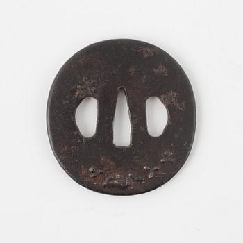 A round iron tsuba, mei, Japan, Edo period (1603-1868).