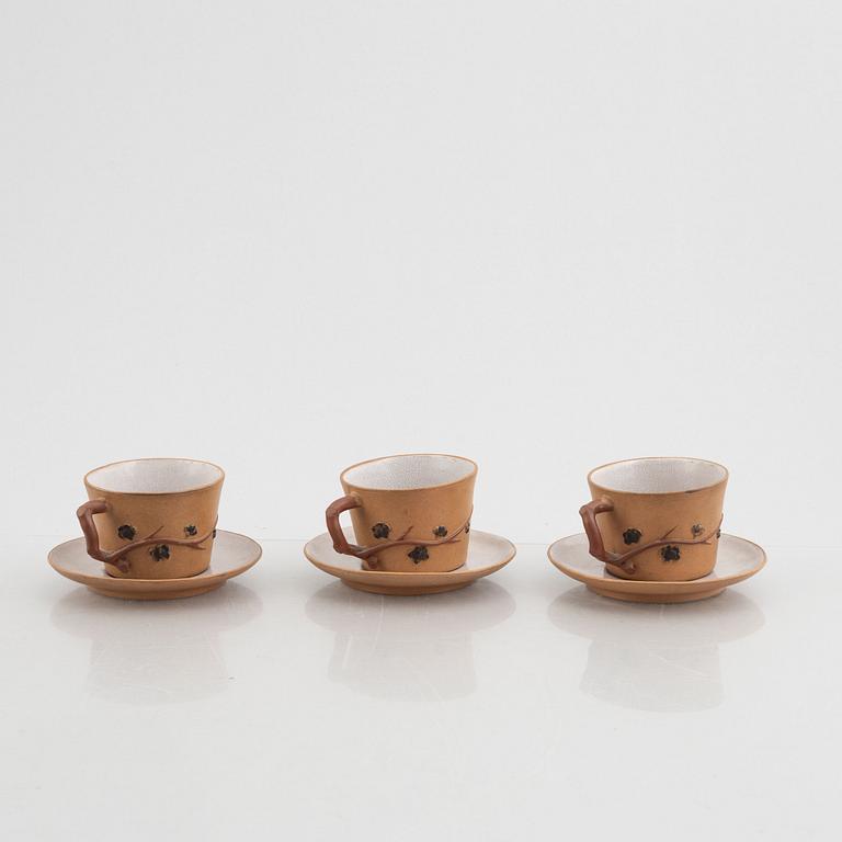 Three Yixing cups with saucers and a bowl, china, early 20th century.