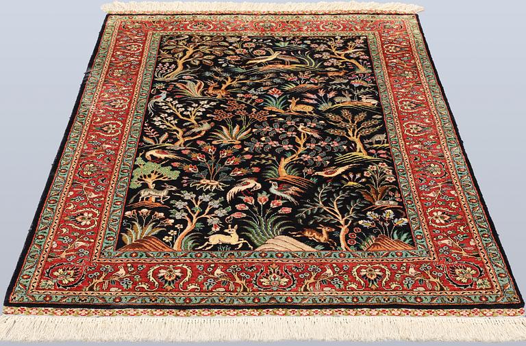 A Tabriz silk rug, approx. 155 x 100 cm.