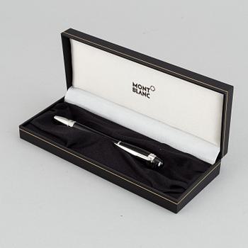 MOntblanc, a ball point pen and leather passport holder.