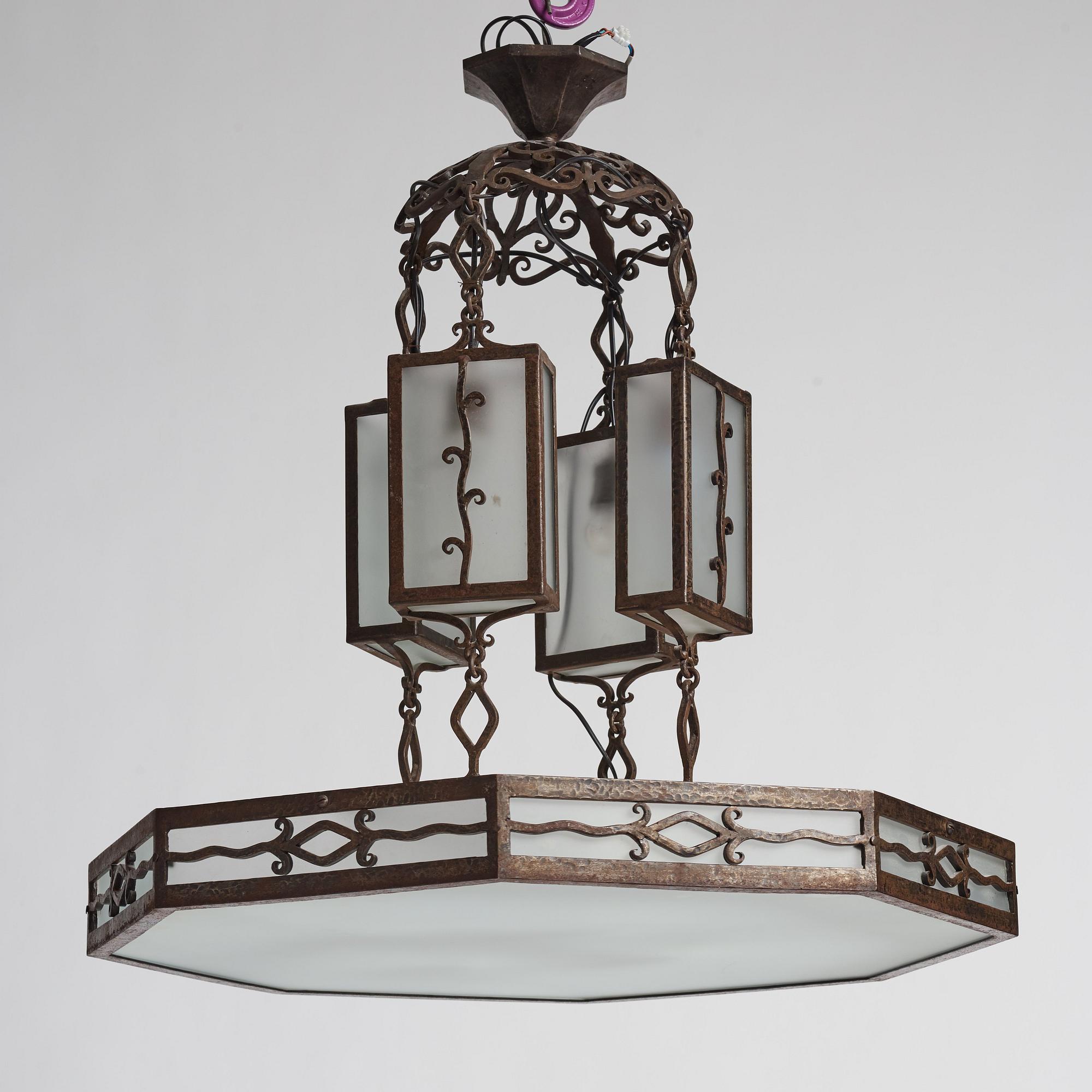 Carl Westman, attributed to, a wrought iron and frosted glass Art Nouveau chandelier, Sweden ca 1915.