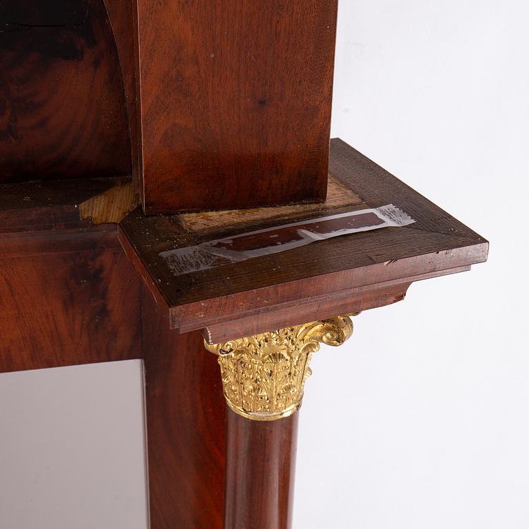 An Empire mirror and console table, first half of the 19th century.