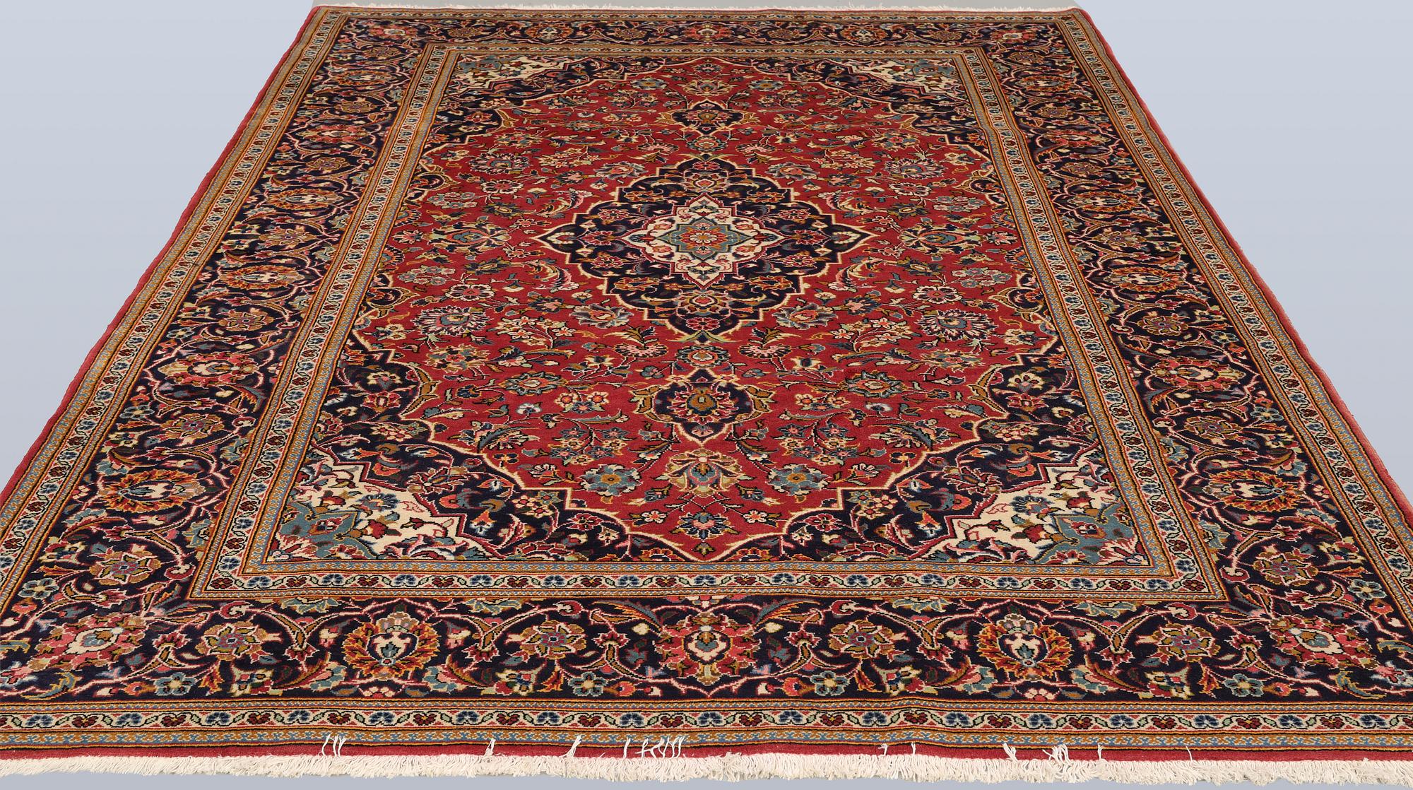 A Keshan rug, approx. 292 x 203 cm.