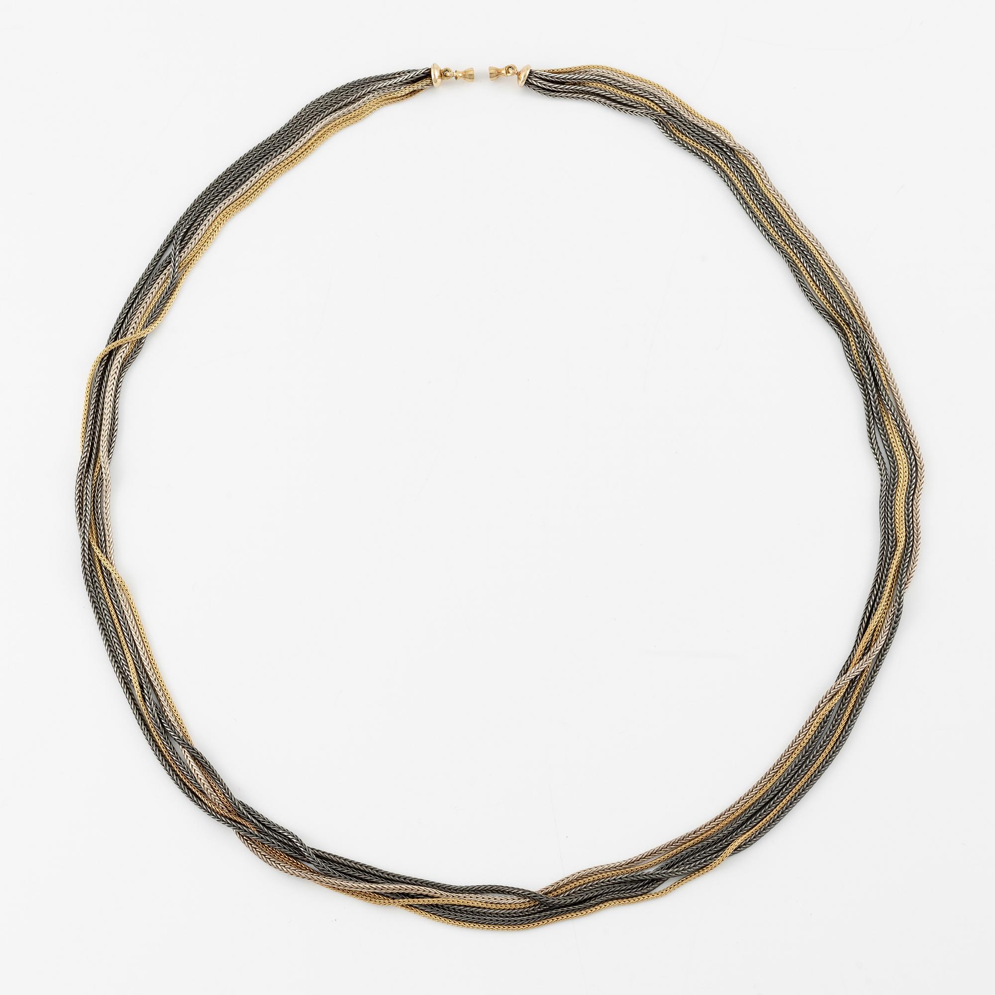 Collier, troligen Ole Lynggaard, sex rader, guld och silver.