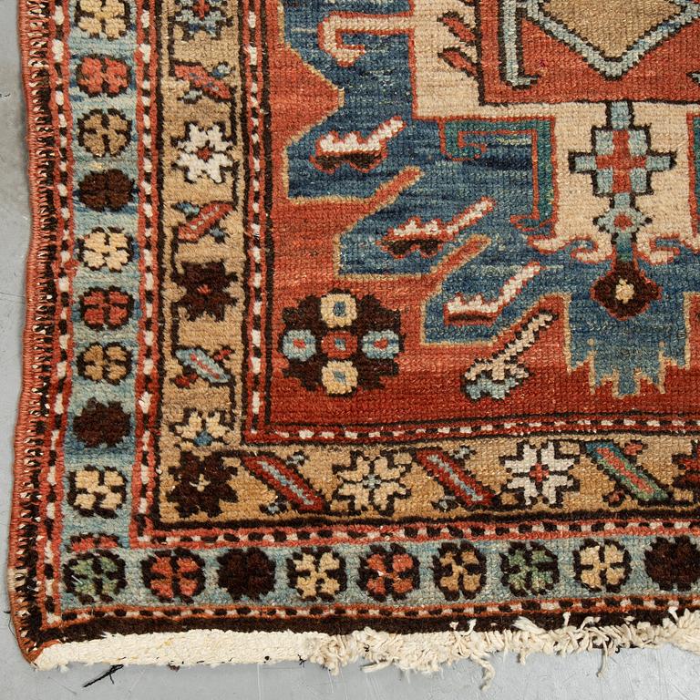 A Heriz runner, ca 310 x 85 cm.